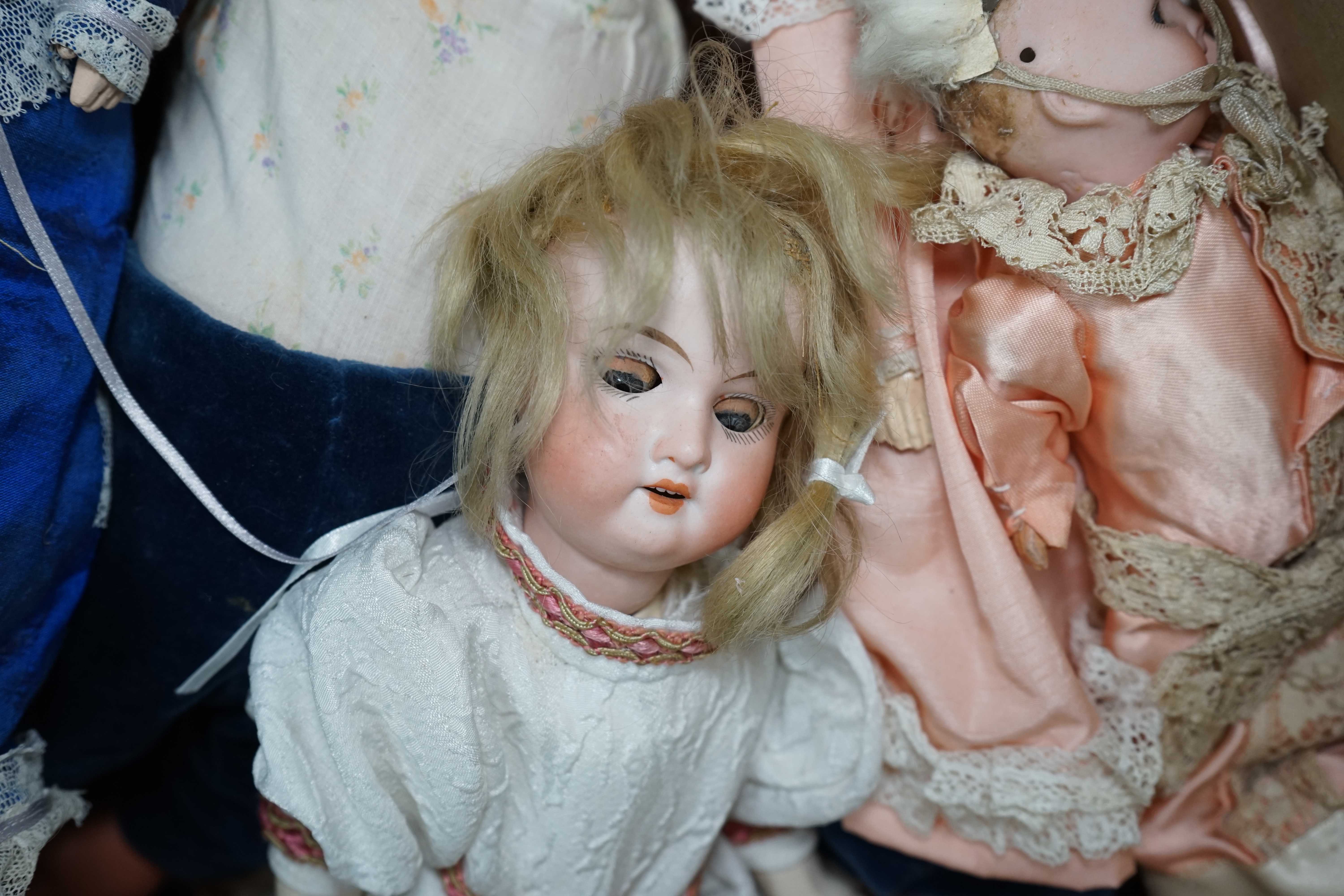 An Armand Marseille bisque doll, mould 390, a small Hermann Steiner bisque doll, three other bisque dolls including an SFBJ 60, and four composition dolls, Armand Marseille 33cm. Condition - poor to fair